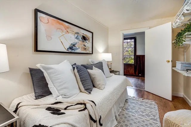 a bedroom with a bed and cupboard