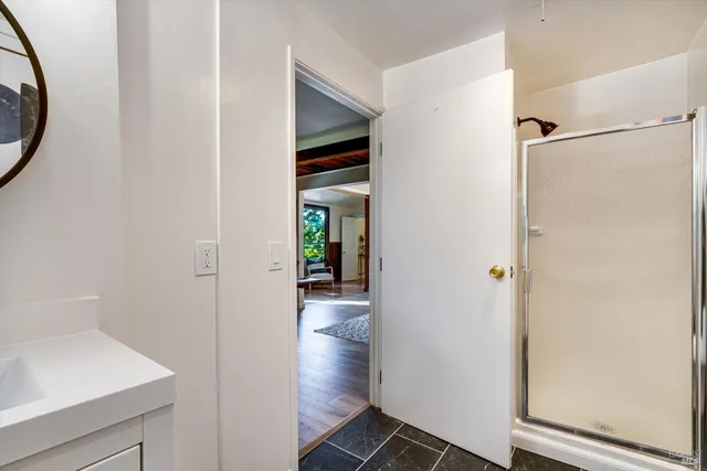 a view of a two chairs in the balcony