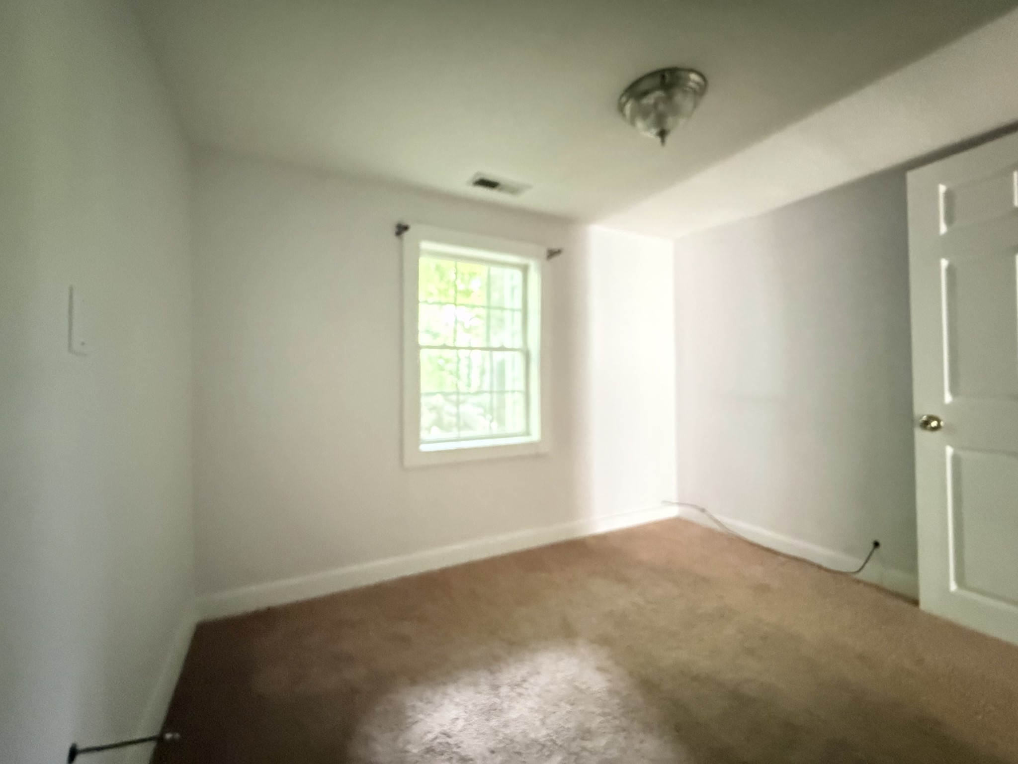2844 Jarman Hollow Road Palmyra, TN 37142 - Photo 14 of 32 an empty room with a window