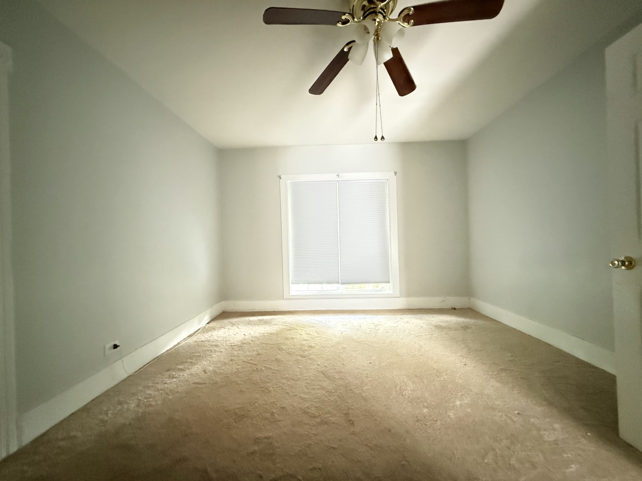 2844 Jarman Hollow Road Palmyra, TN 37142 - Photo 17 of 32 an empty room with a window and a fan
