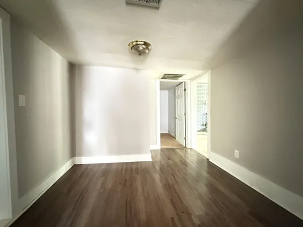 a view of a livingroom with wooden floor