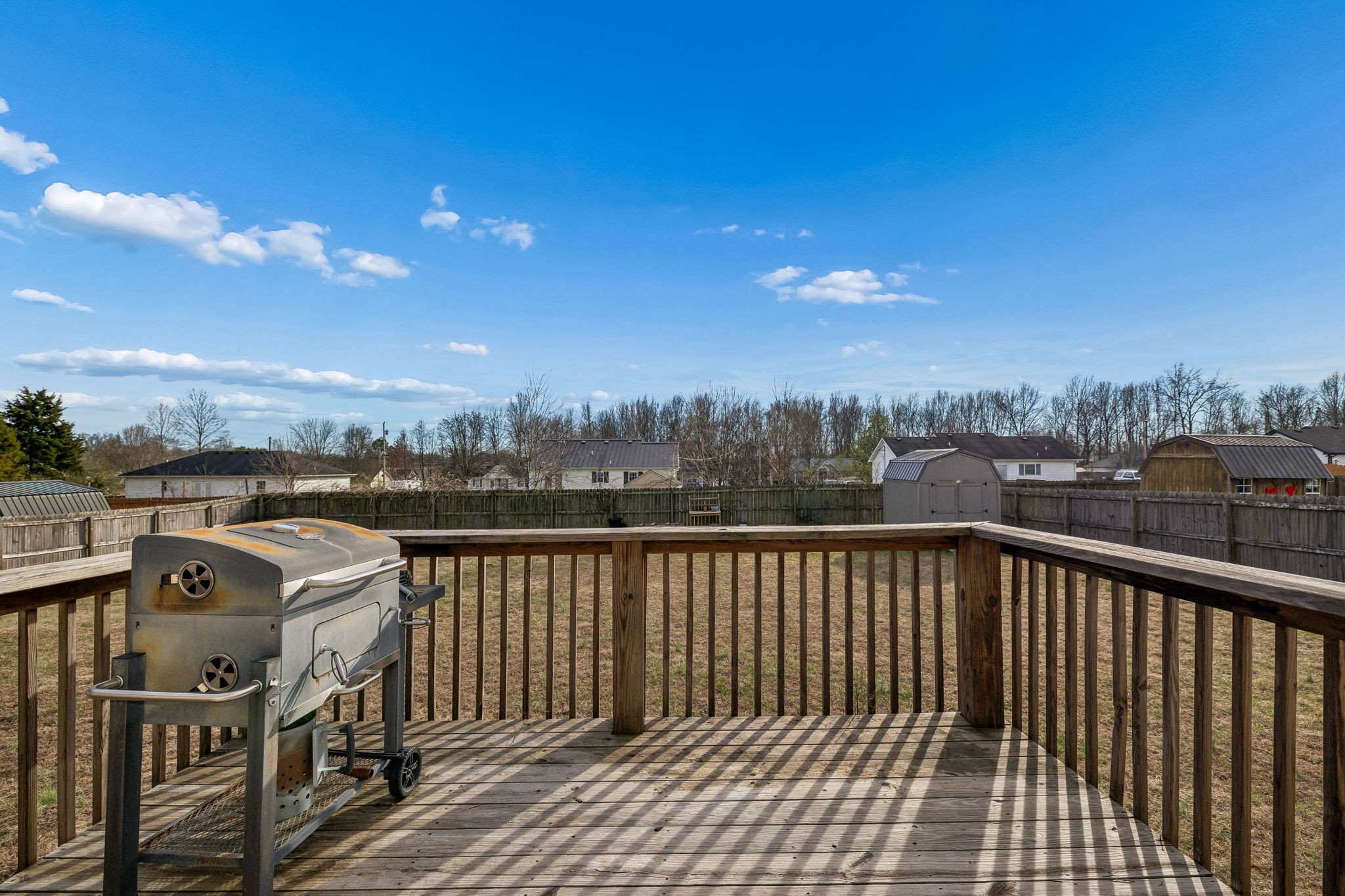 136 Thacker Drive Portland, TN 37148 - Photo 26 of 39 a view of a balcony with wooden fence
