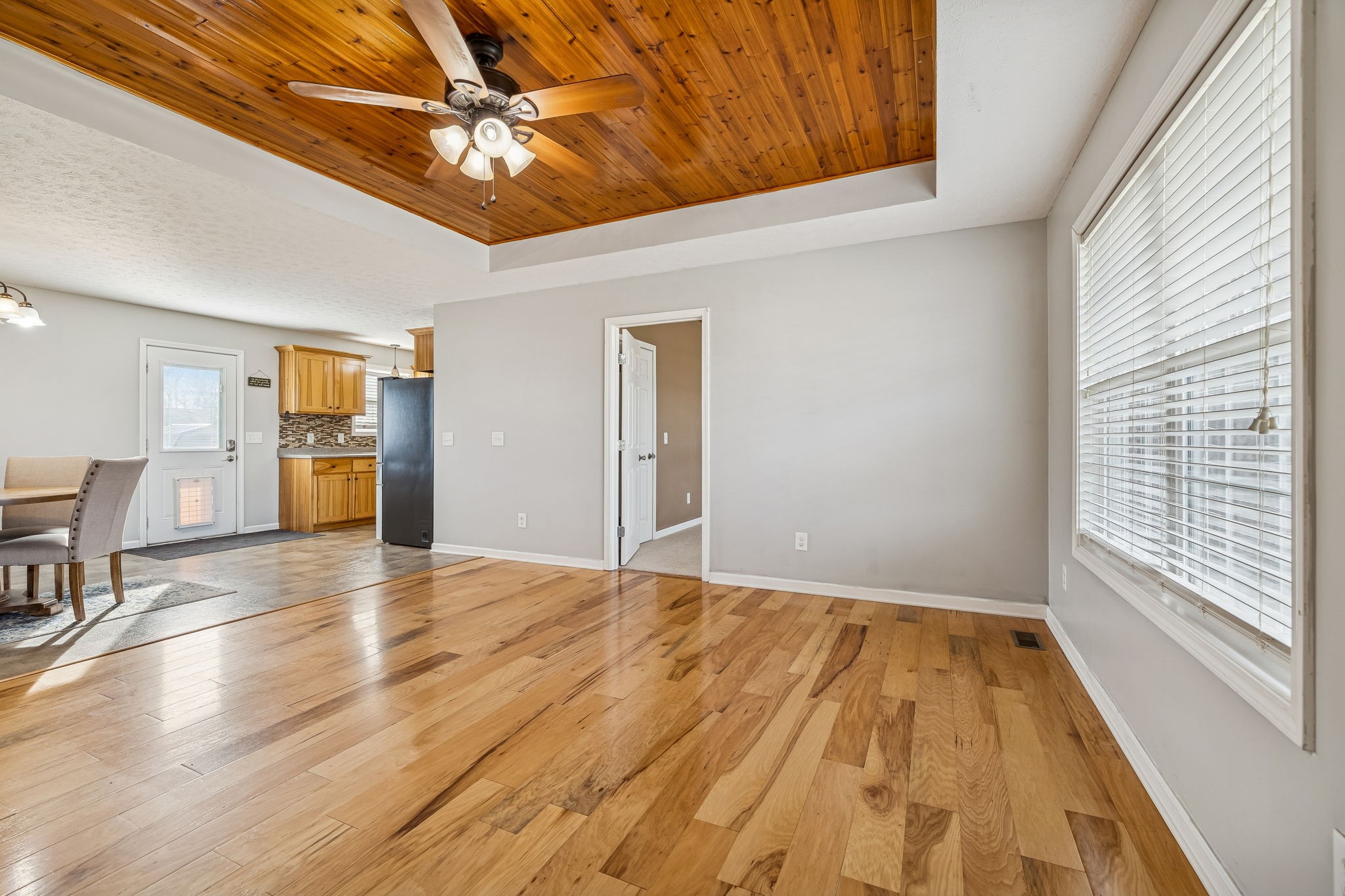 136 Thacker Drive Portland, TN 37148 - Photo 3 of 39 a view of empty room with wooden floor and fan