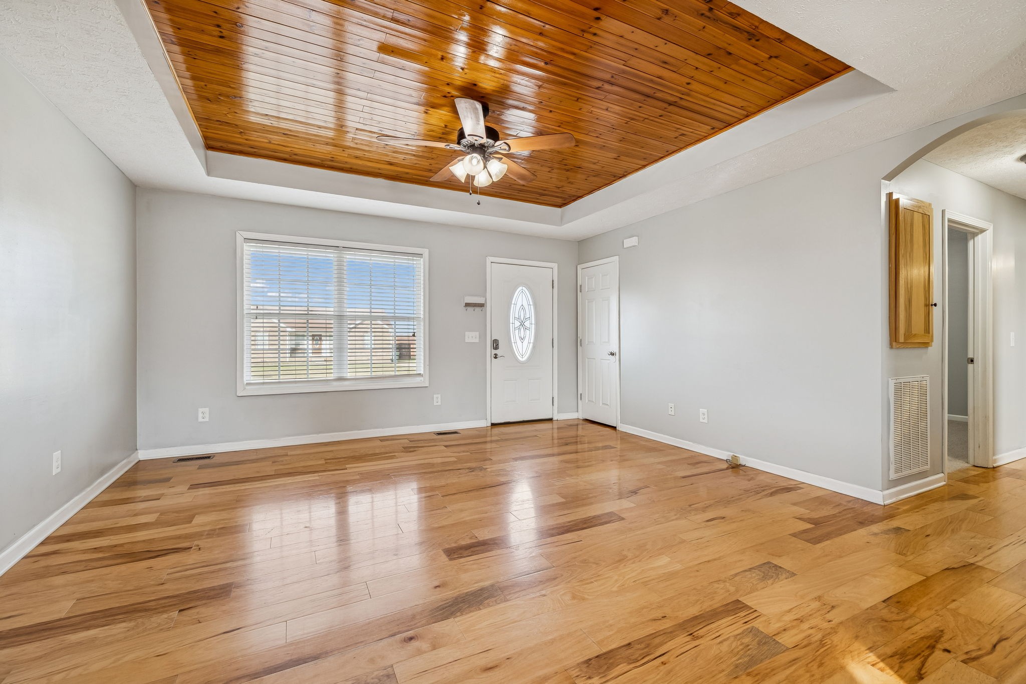 136 Thacker Drive Portland, TN 37148 - Photo 4 of 39 a view of an empty room with wooden floor and a window