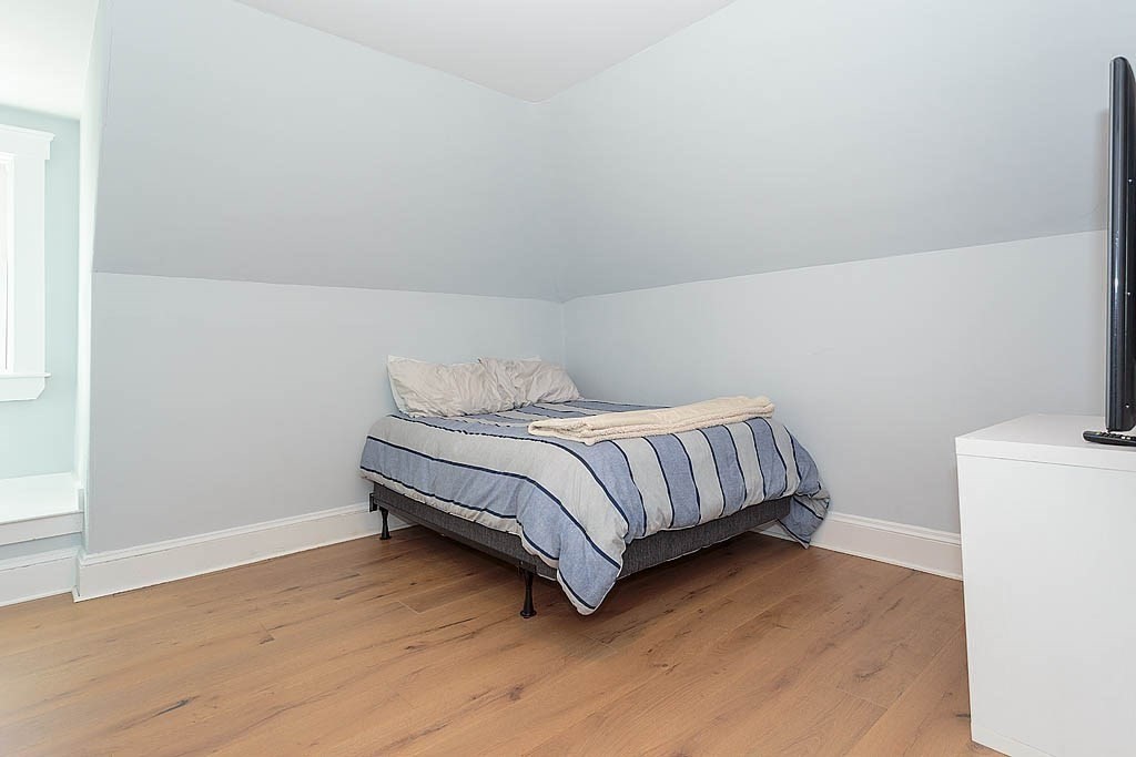 79 Robert Street, Unit 3 Boston, MA 02131 - Photo 17 of 20 a bedroom with a bed and a night stand