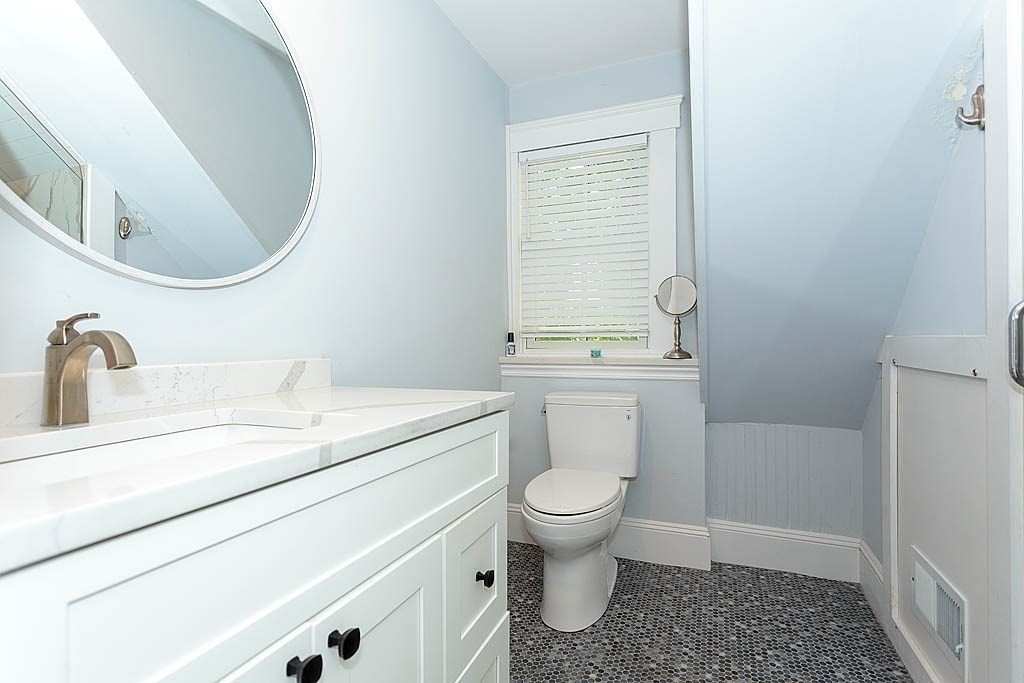 79 Robert Street, Unit 3 Boston, MA 02131 - Photo 20 of 20 a bathroom with a sink a toilet and a mirror