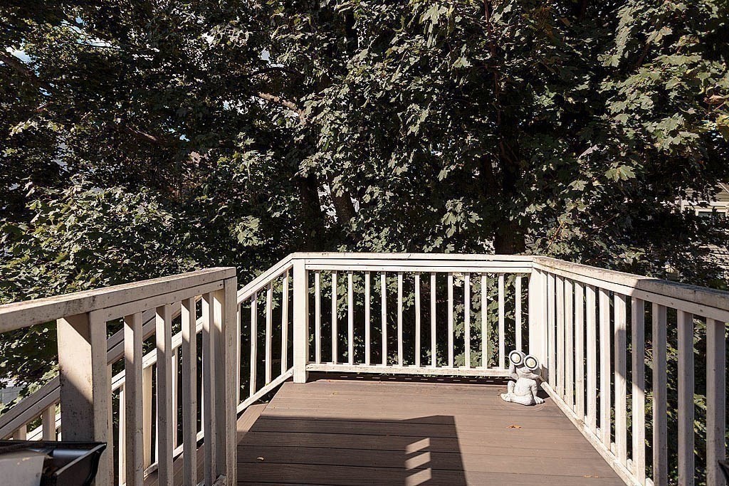 79 Robert Street, Unit 3 Boston, MA 02131 - Photo 6 of 20 a balcony with wooden fence