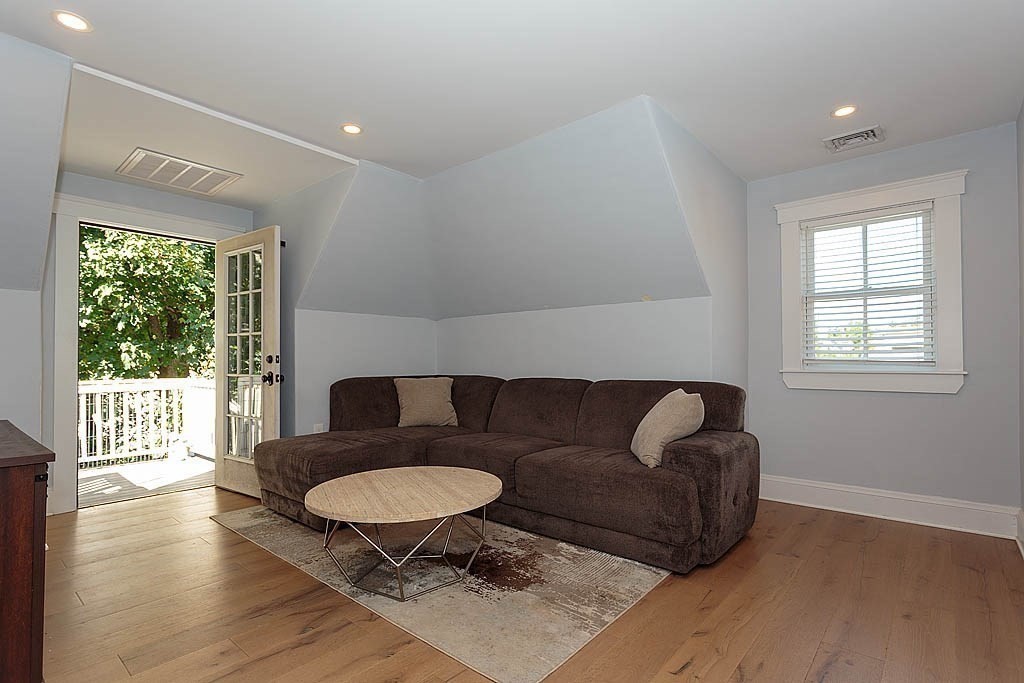 79 Robert Street, Unit 3 Boston, MA 02131 - Photo 7 of 20 a living room with furniture and a wooden floor
