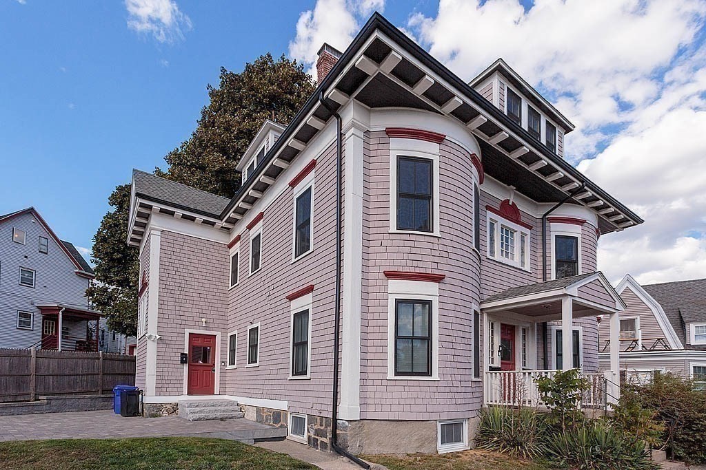 79 Robert Street, Unit 3 Boston, MA 02131 - Photo 8 of 20 a front view of a house with a yard