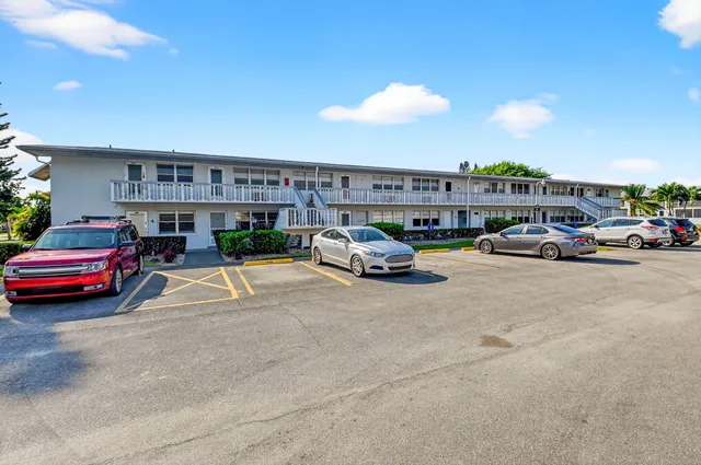 a view of cars parked in front of a building