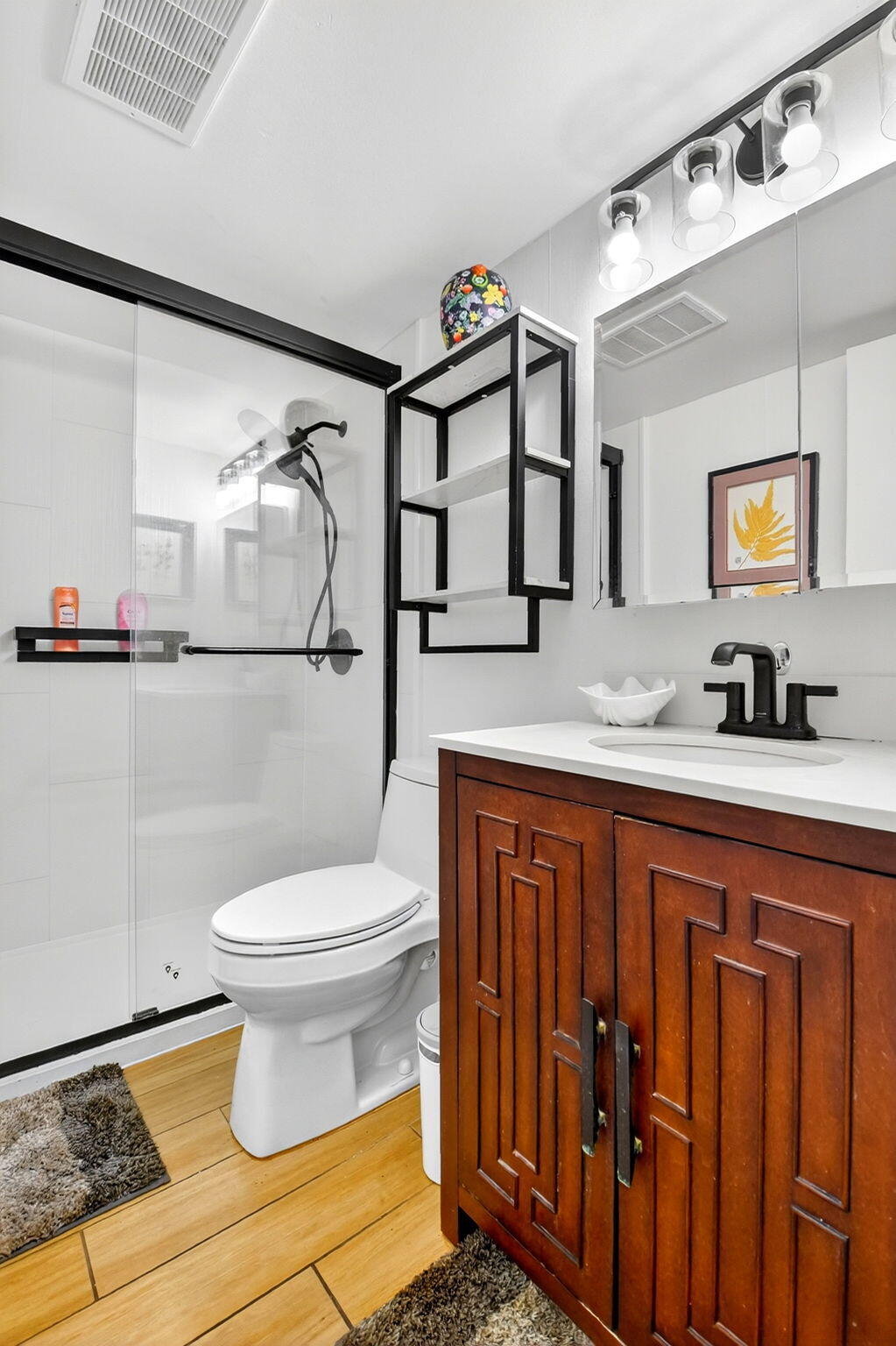 332 Northampton Q West Palm Beach, FL 33417 - Photo 15 of 42 a bathroom with a granite countertop sink mirror vanity and toilet