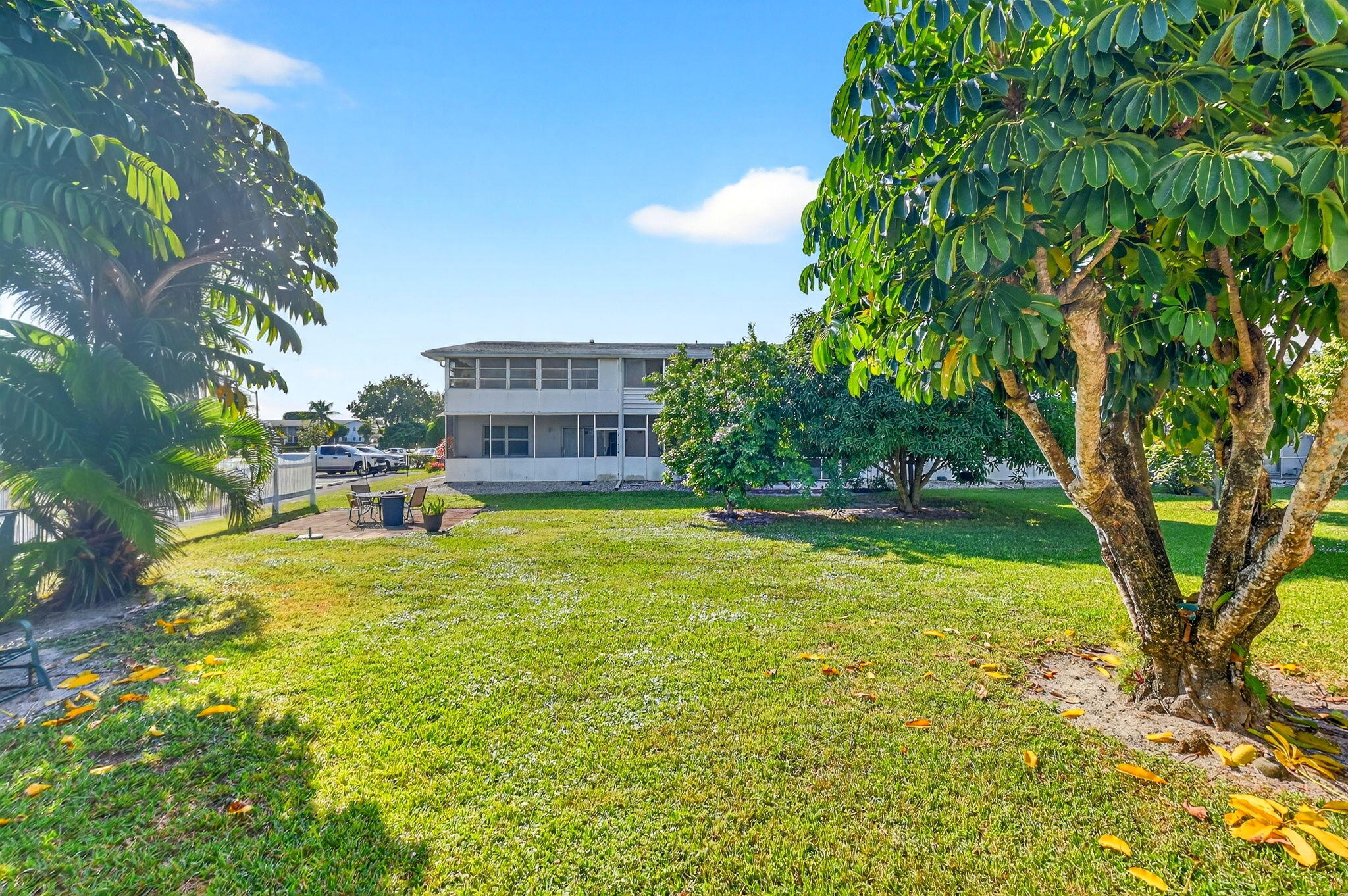 332 Northampton Q West Palm Beach, FL 33417 - Photo 22 of 42 a swimming pool with trees in front of it