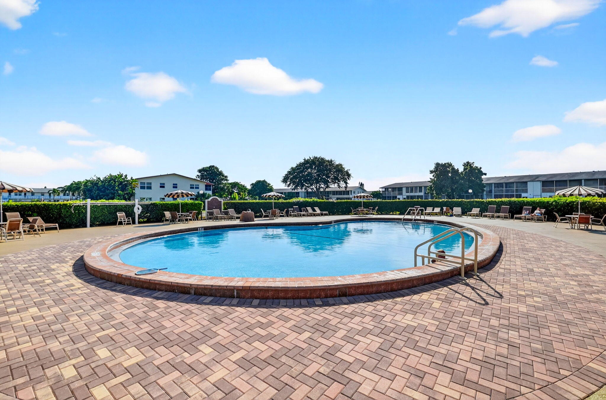 332 Northampton Q West Palm Beach, FL 33417 - Photo 23 of 42 a view of a swimming pool with a yard