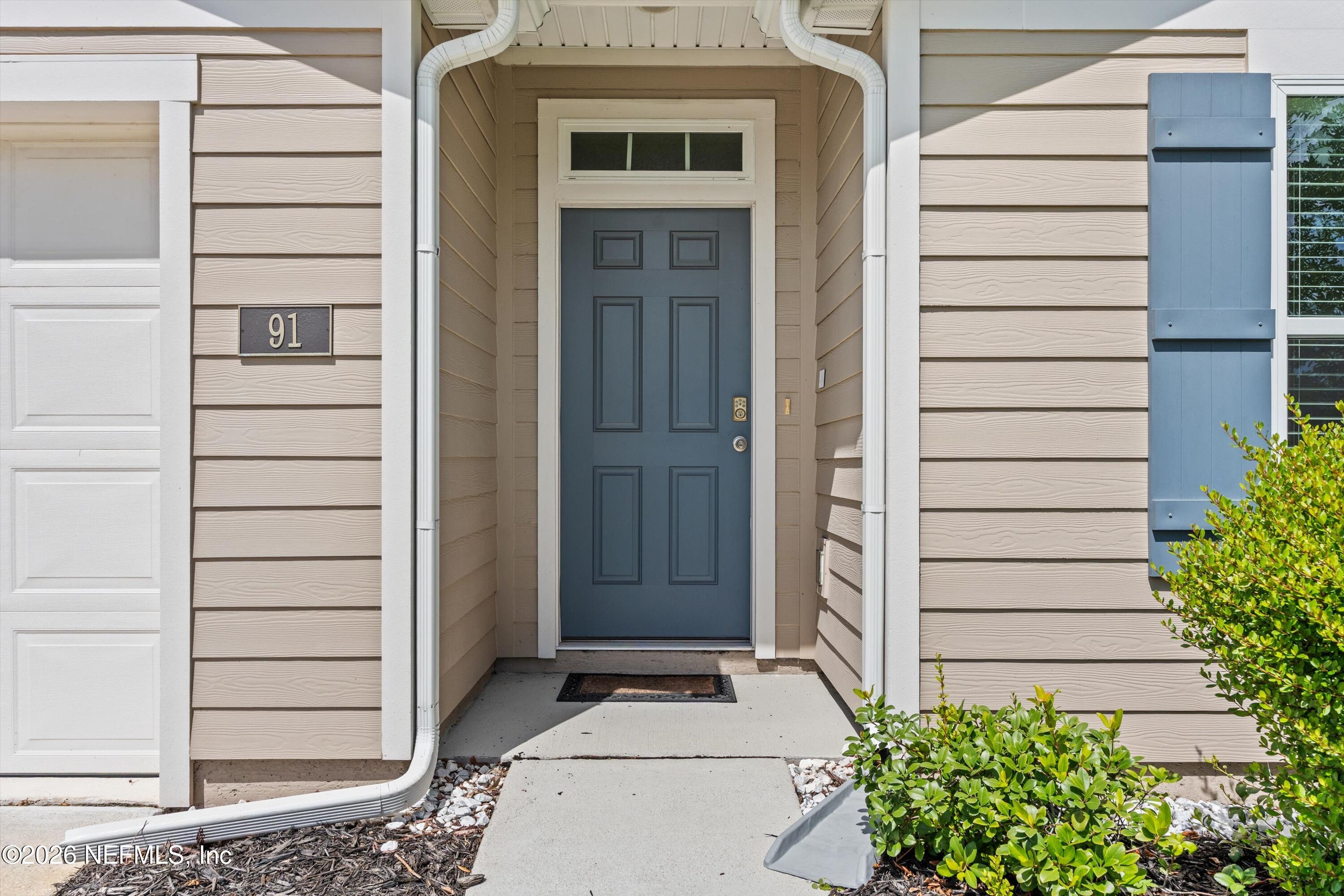 91 Rivertown Road Palm Coast, FL 32137 - Photo 2 of 36 04-Front Door