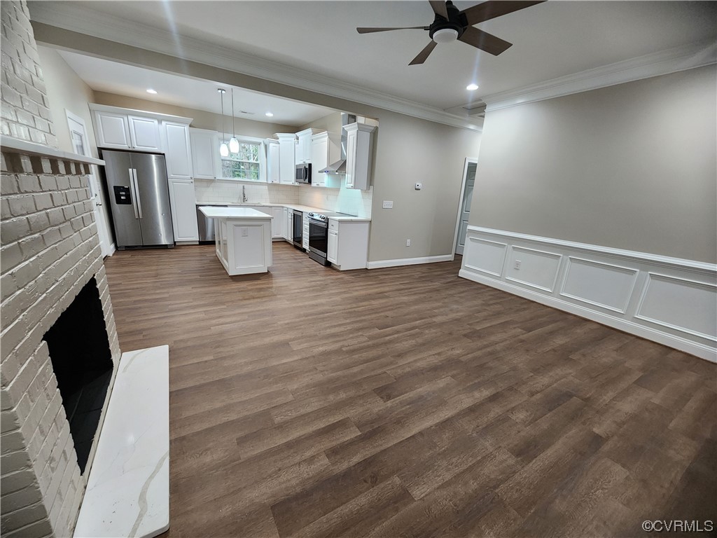 2813 Parkdale Road North Chesterfield, VA 23234 - Photo 12 of 36 a view of a kitchen with furniture and a fireplace