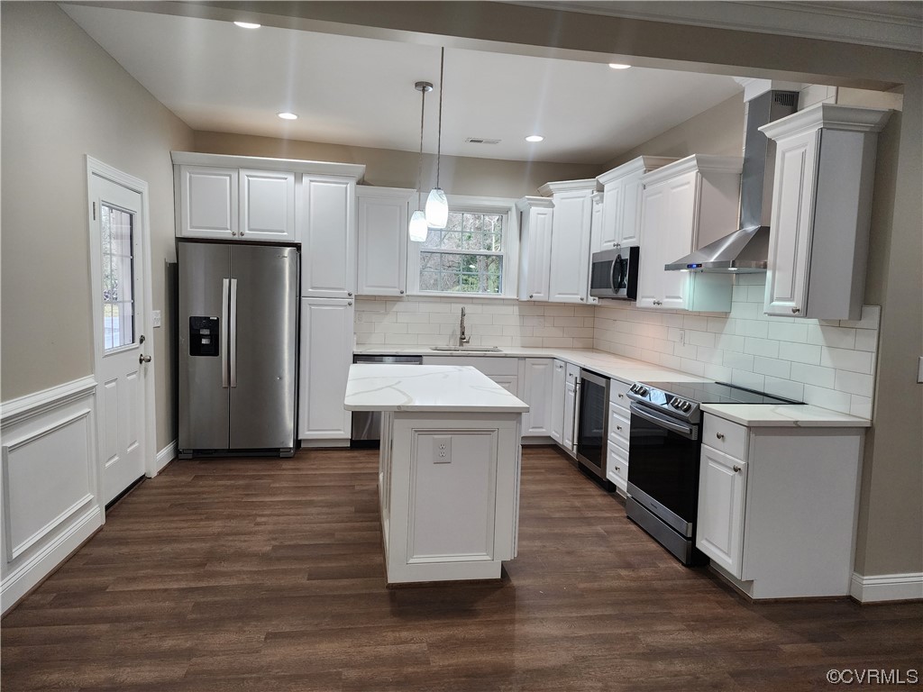 2813 Parkdale Road North Chesterfield, VA 23234 - Photo 14 of 36 a kitchen with stainless steel appliances a sink stove refrigerator and cabinets