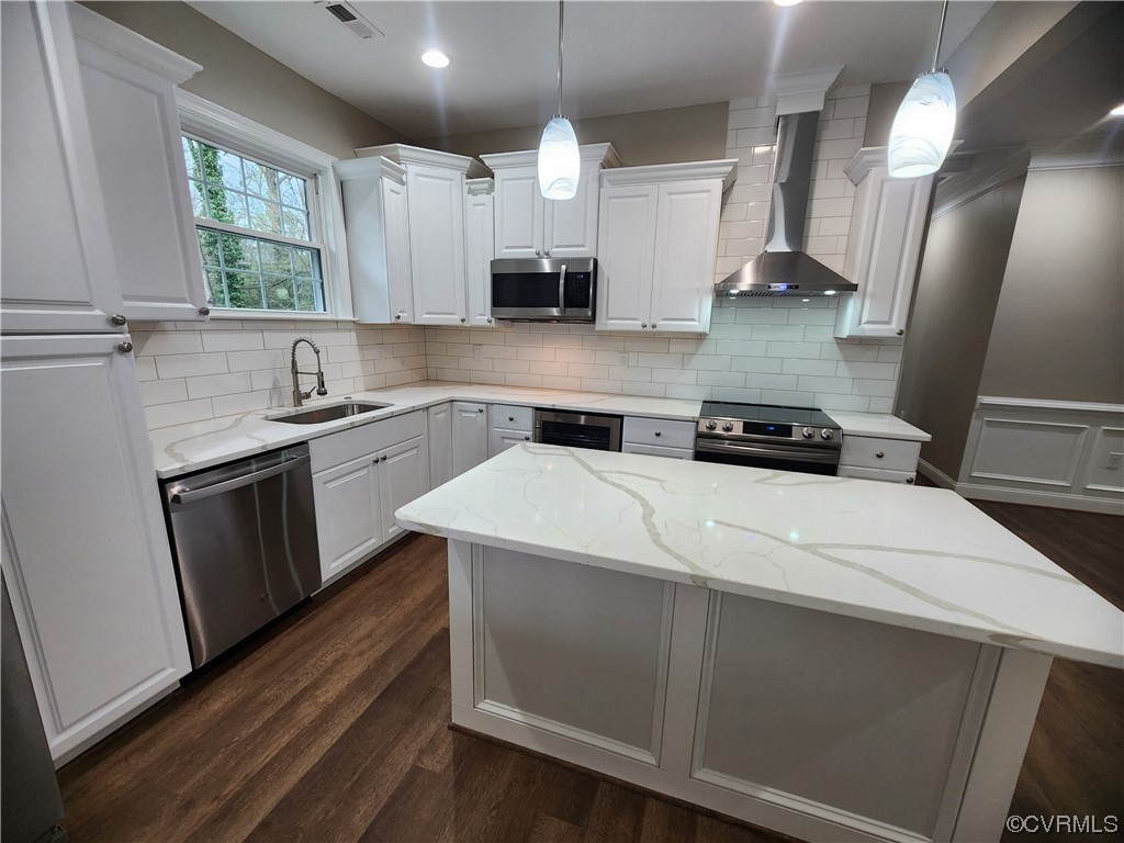 2813 Parkdale Road North Chesterfield, VA 23234 - Photo 15 of 36 a kitchen with a stove a sink a window and cabinets