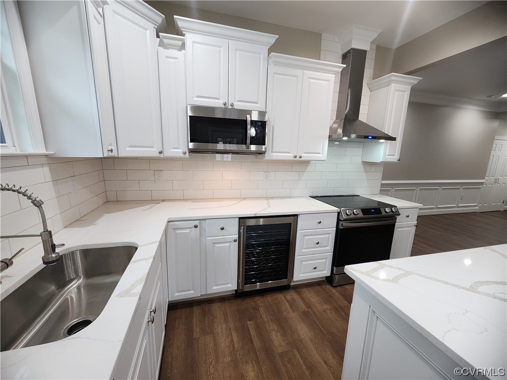 2813 Parkdale Road North Chesterfield, VA 23234 - Photo 16 of 36 a kitchen with stainless steel appliances white cabinets a sink dishwasher a stove and a microwave oven with white cabinets