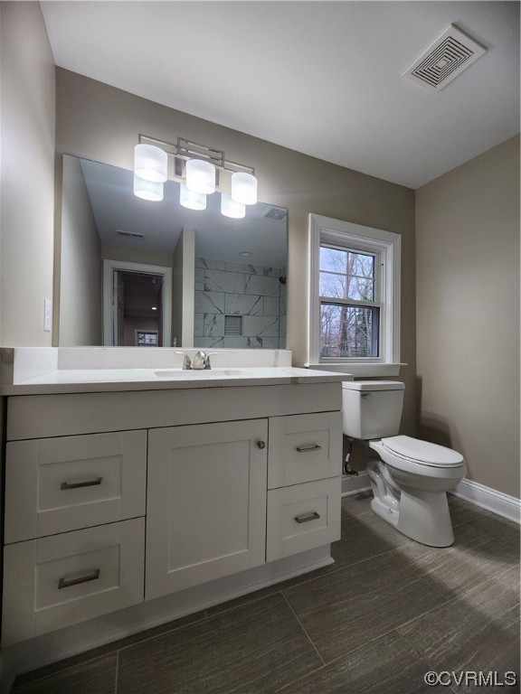 2813 Parkdale Road North Chesterfield, VA 23234 - Photo 29 of 36 a bathroom with a toilet sink and mirror