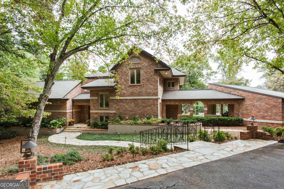 160 Renfrew Drive Athens, GA 30606 - Photo 1 of 1 a front view of a house with a garden and plants