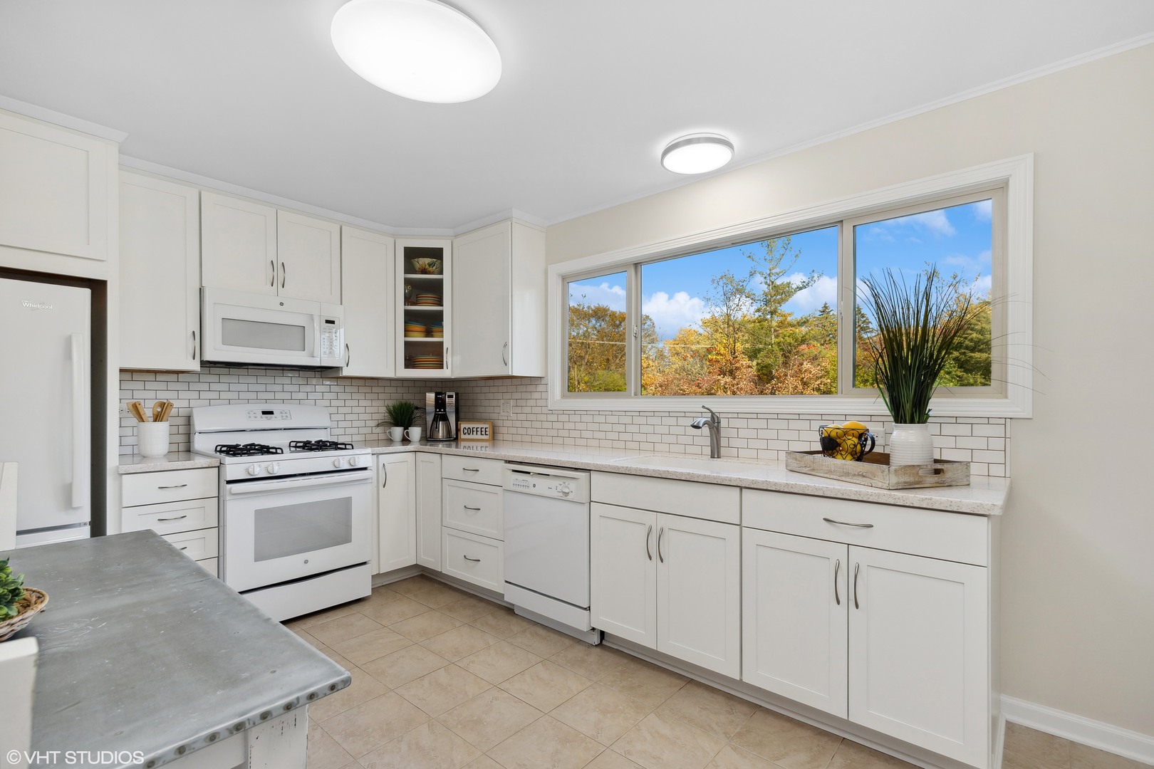 575 Forest View Road Lindenhurst, IL 60046 - Photo 5 of 21 a kitchen with white cabinets and sink