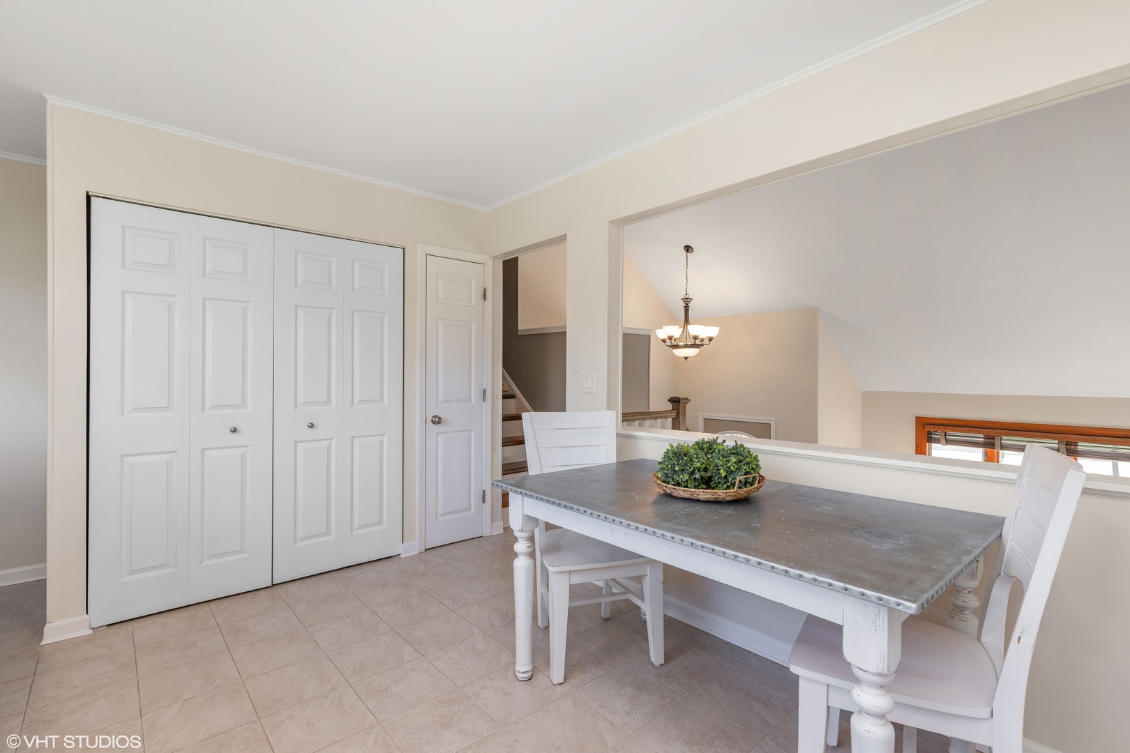 575 Forest View Road Lindenhurst, IL 60046 - Photo 7 of 21 a dining room with a table and chairs