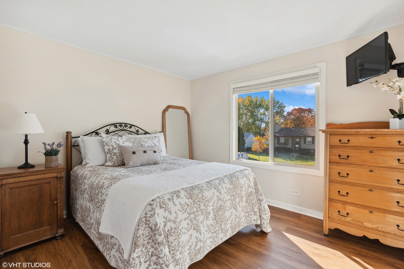 575 Forest View Road Lindenhurst, IL 60046 - Photo 9 of 21 a bedroom with a bed and a flat screen tv