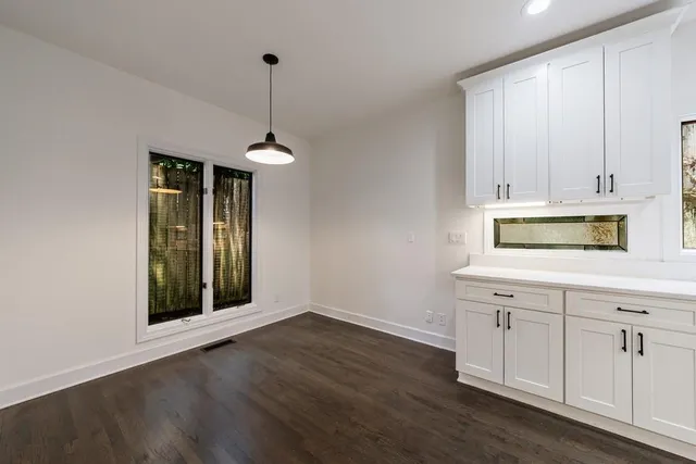 a kitchen with appliances cabinets and a sink
