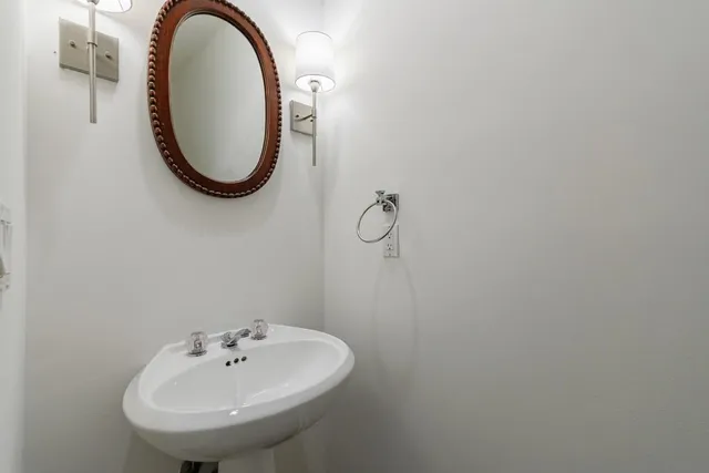 a view of a storage and utility room with washer and dryer