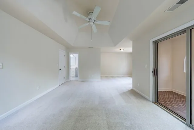 a view of a livingroom with furniture and staircase