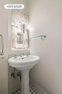 a bath room with a sink and a bath tub