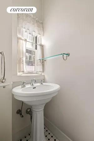 a bath room with a sink and a bath tub