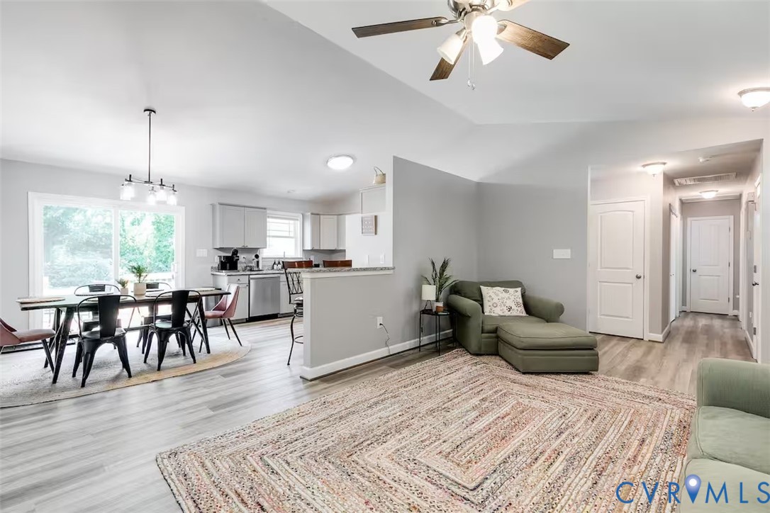 711 Jackson Street Colonial Beach, VA 22443 - Photo 11 of 41 a living room with furniture and a wooden floor