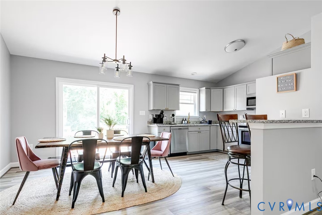 711 Jackson Street Colonial Beach, VA 22443 - Photo 12 of 41 a view of a dining room with furniture window and wooden floor