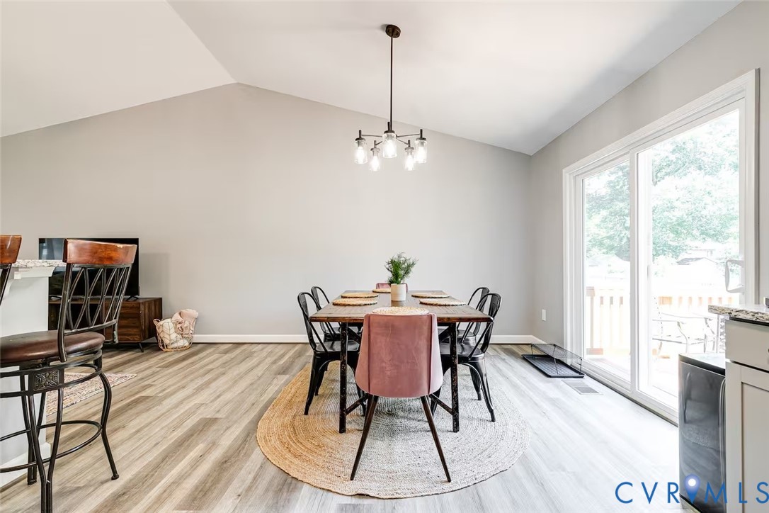711 Jackson Street Colonial Beach, VA 22443 - Photo 16 of 41 a view of a dining room with furniture window and outside view