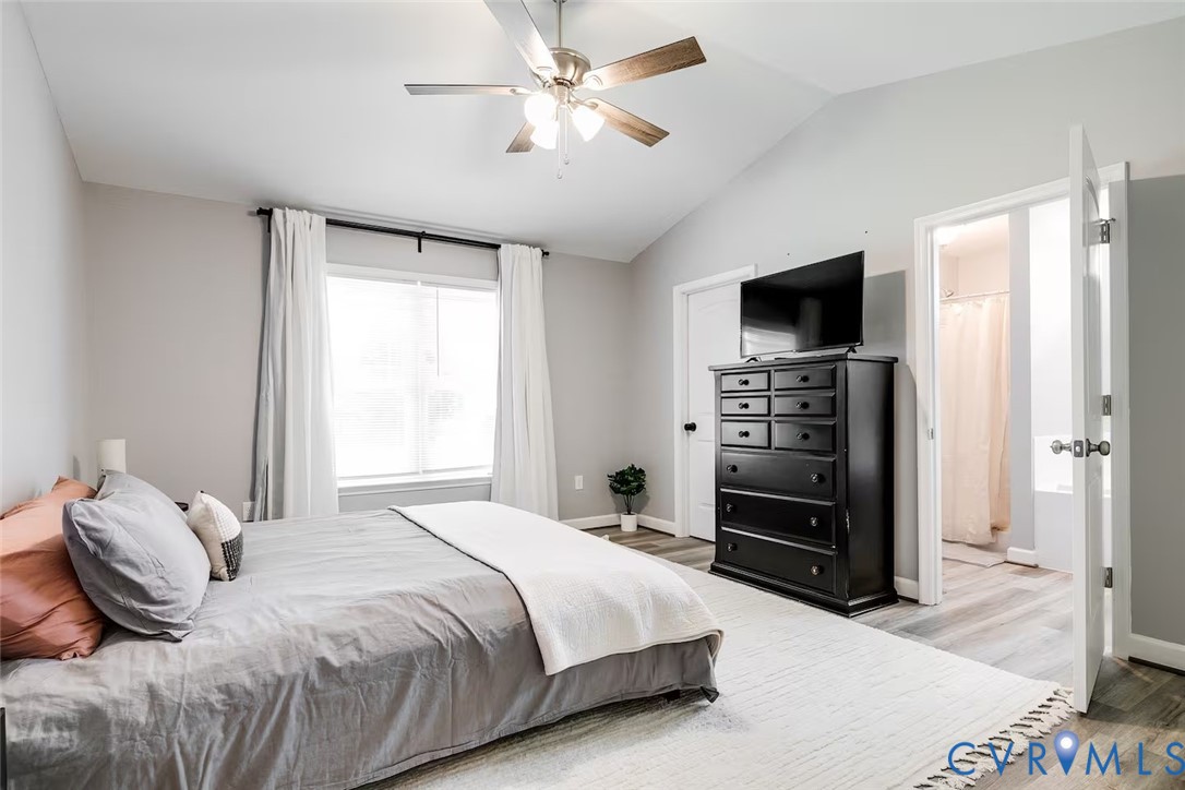 711 Jackson Street Colonial Beach, VA 22443 - Photo 26 of 41 a bedroom with a bed and a flat screen tv