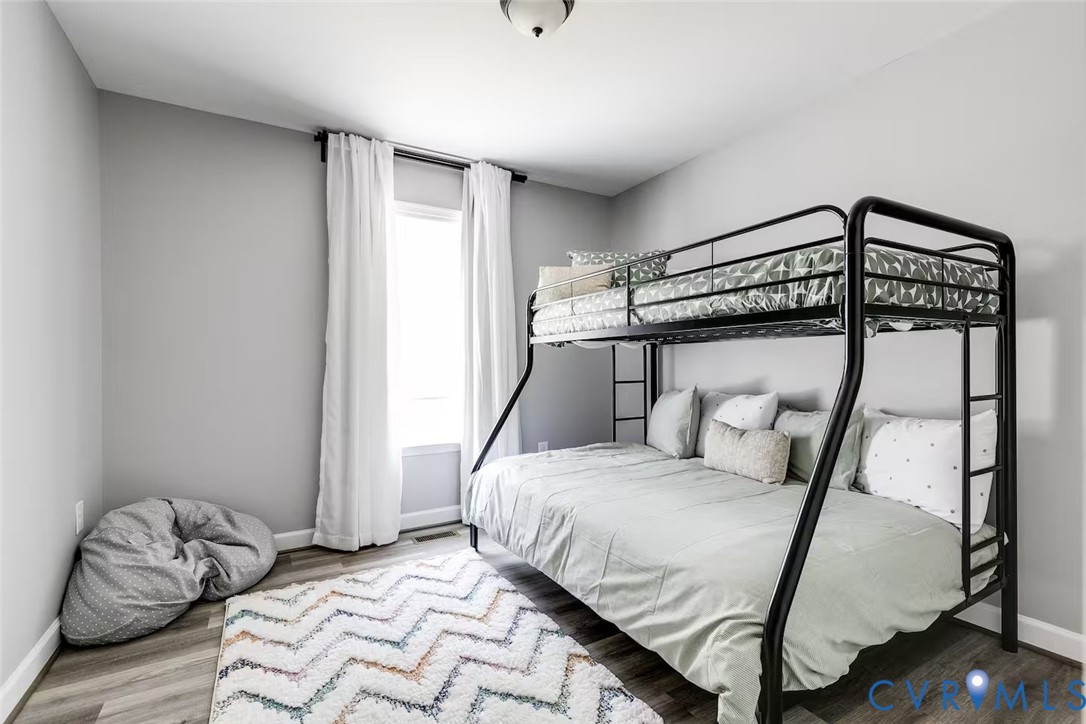 711 Jackson Street Colonial Beach, VA 22443 - Photo 29 of 41 a bedroom with a bed and a window