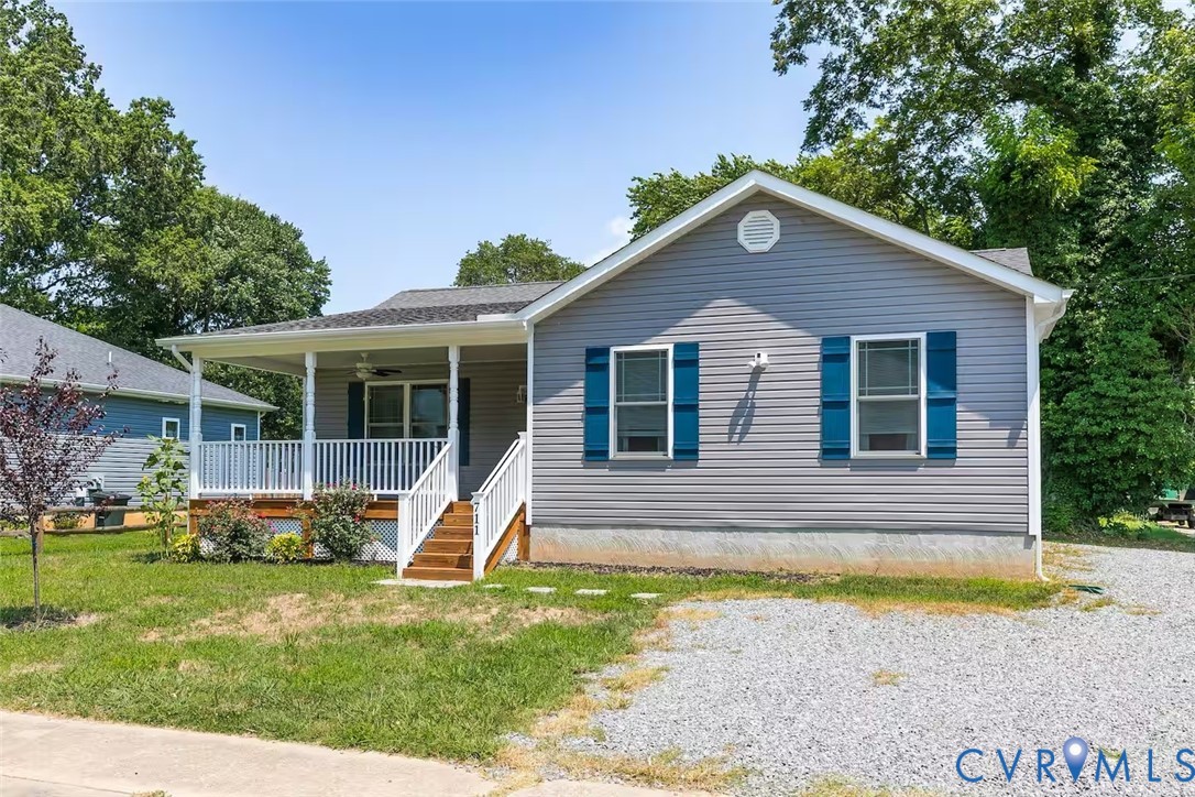 711 Jackson Street Colonial Beach, VA 22443 - Photo 3 of 41 a front view of a house with garden