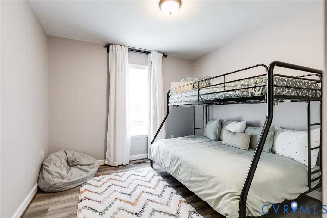 711 Jackson Street Colonial Beach, VA 22443 - Photo 32 of 41 a bedroom with a bed and a window