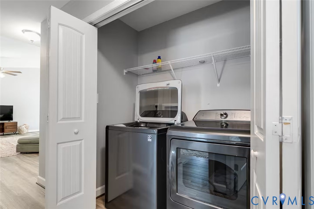 711 Jackson Street Colonial Beach, VA 22443 - Photo 37 of 41 a kitchen with stainless steel appliances granite countertop a stove and a refrigerator