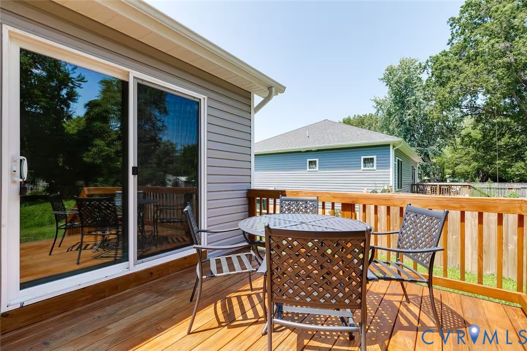 711 Jackson Street Colonial Beach, VA 22443 - Photo 38 of 41 a view of house with roof deck and furniture
