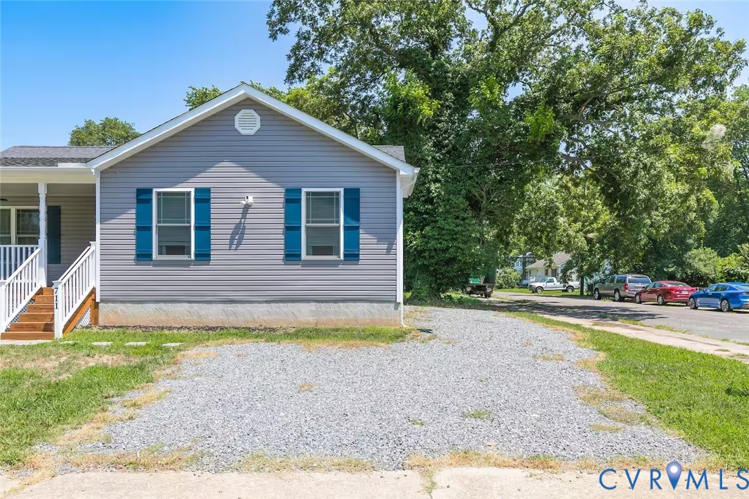 711 Jackson Street Colonial Beach, VA 22443 - Photo 4 of 41 a view of a house with backyard and trees