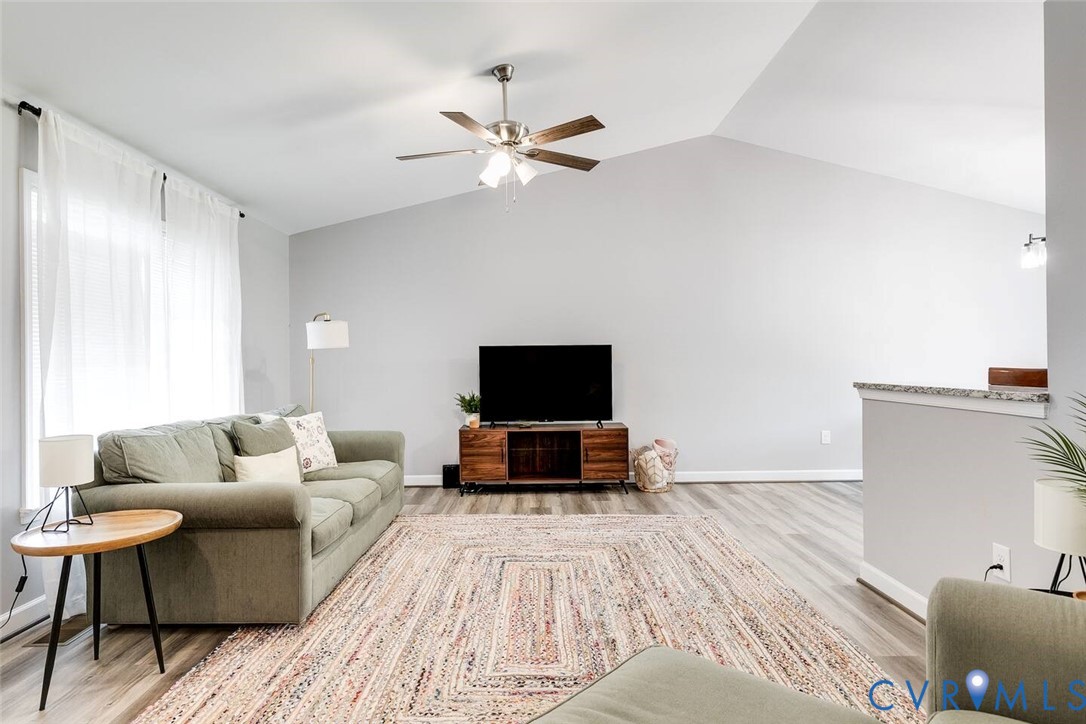 711 Jackson Street Colonial Beach, VA 22443 - Photo 6 of 41 a living room with furniture and a flat screen tv