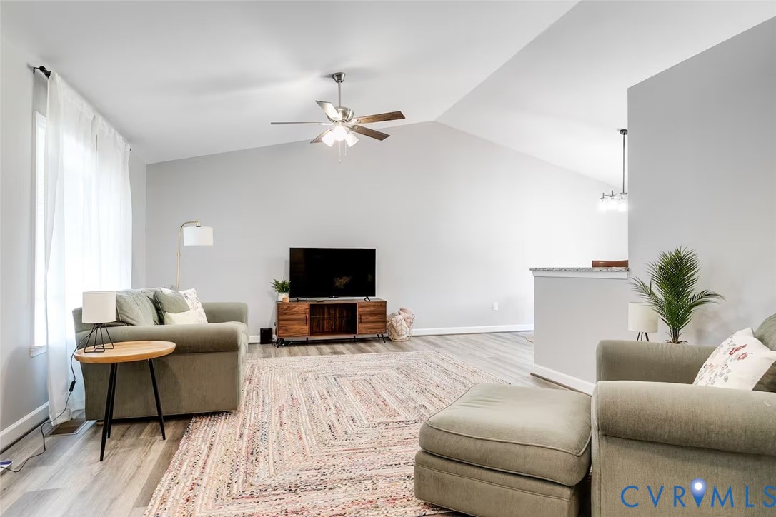 711 Jackson Street Colonial Beach, VA 22443 - Photo 7 of 41 a living room with furniture and a flat screen tv
