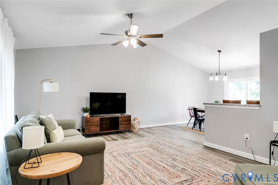 711 Jackson Street Colonial Beach, VA 22443 - Photo 8 of 41 a living room with furniture and a flat screen tv