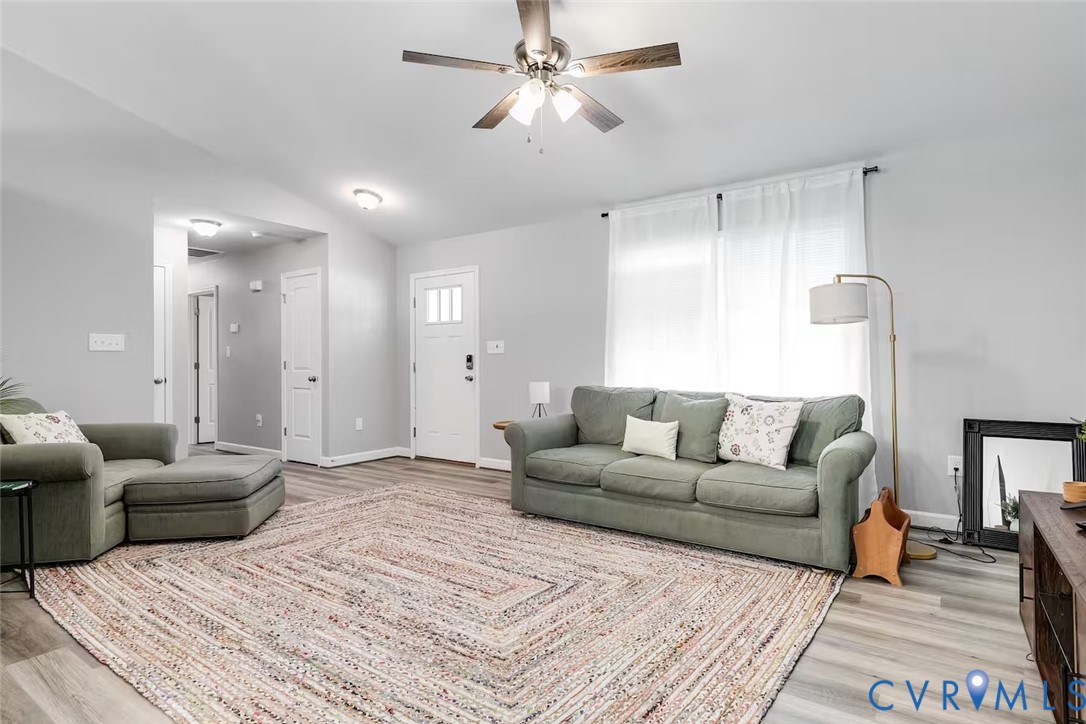 711 Jackson Street Colonial Beach, VA 22443 - Photo 9 of 41 a living room with furniture and a couch