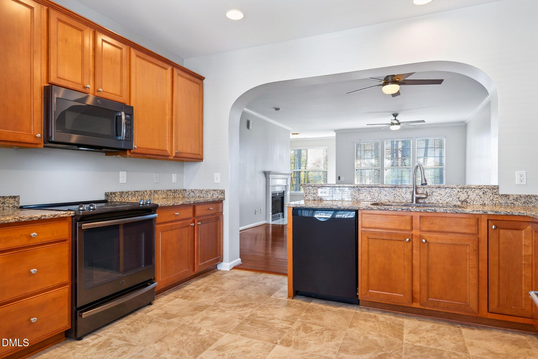 4523 Pale Moss Drive Raleigh, NC 27606 - Photo 2 of 42 a kitchen with stainless steel appliances granite countertop a stove top oven a sink dishwasher and a microwave oven with cabinets