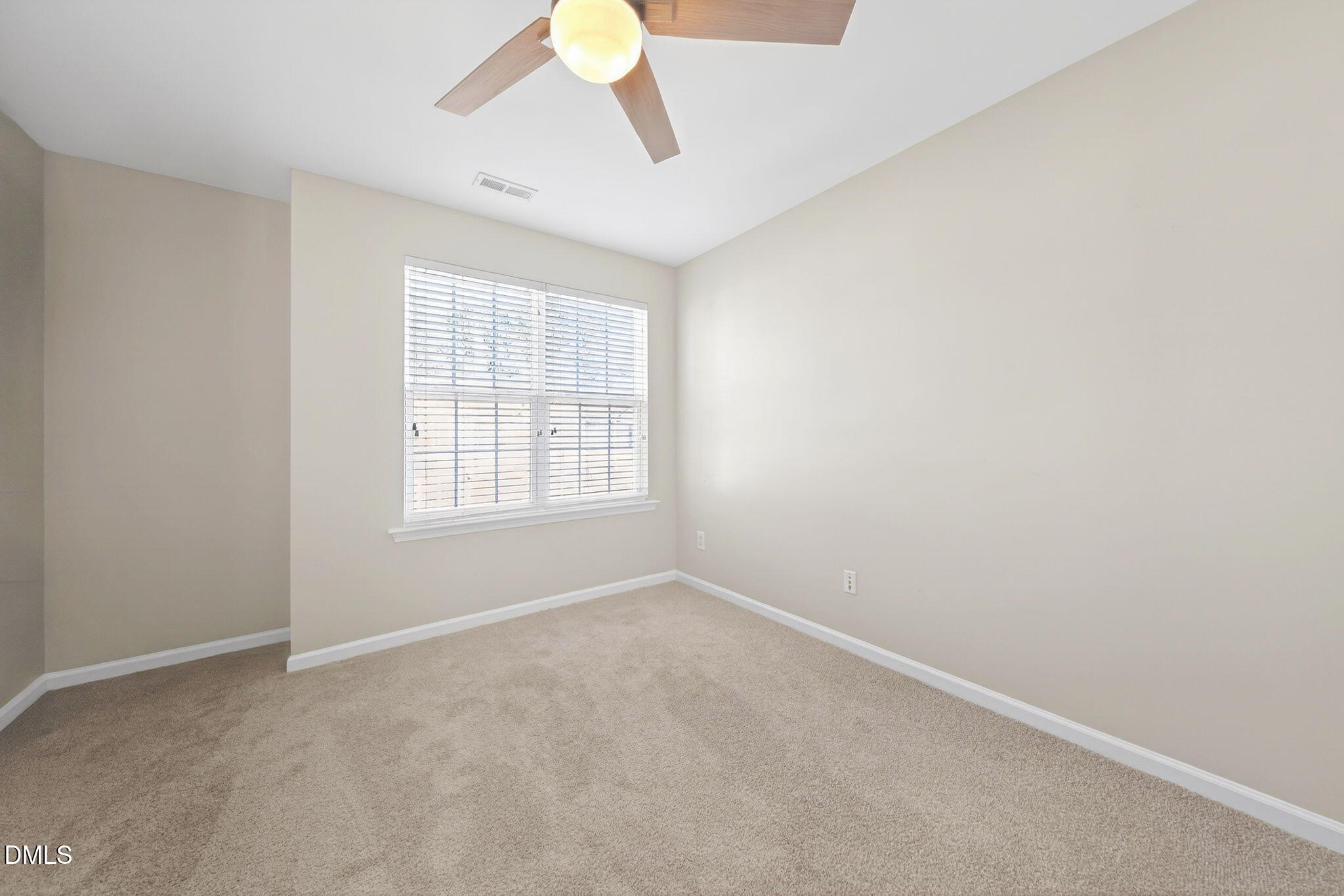 4523 Pale Moss Drive Raleigh, NC 27606 - Photo 31 of 42 a view of an empty room with a window