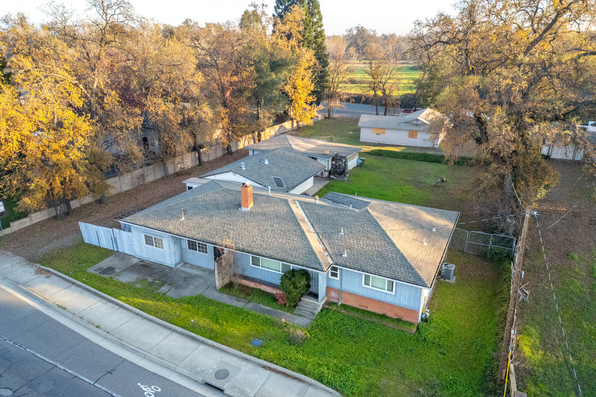 an aerial view of a house with swimming pool garden and patio