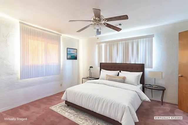 a bedroom with a bed and window